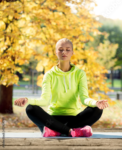 Photo: woman doing yoga outdoors woman doing yoga outdoors