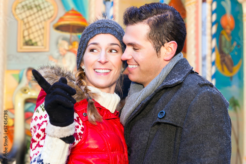 Photo: Couple during the Christmas market or advent season Couple during the Christmas market or advent season