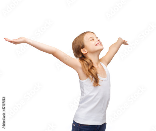 Photo: smiling teenage girl with raised hands smiling teenage girl with raised hands