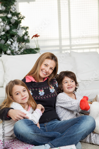 Photo: Mother And Children At Home During Christmas Mother And Children At Home During Christmas