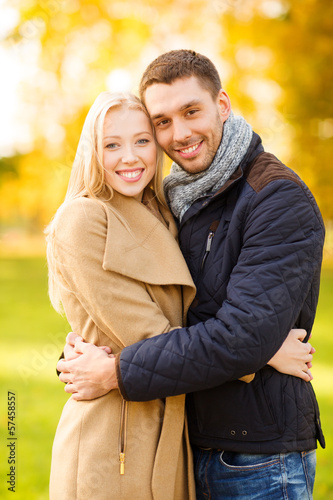 Photo: romantic couple in the autumn park romantic couple in the autumn park