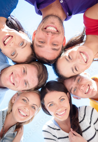 Photo: group of teenagers looking down group of teenagers looking down