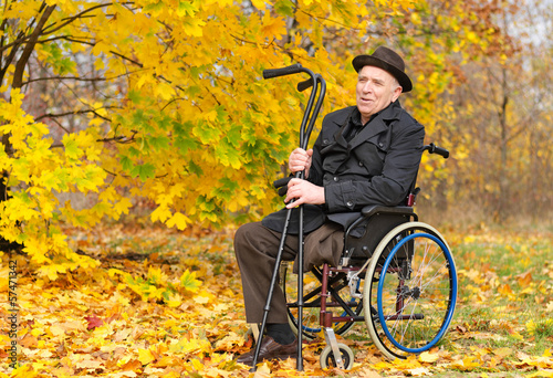 Photo: Happy handicapped senior enjoying the autumn sun Happy handicapped senior enjoying the autumn sun