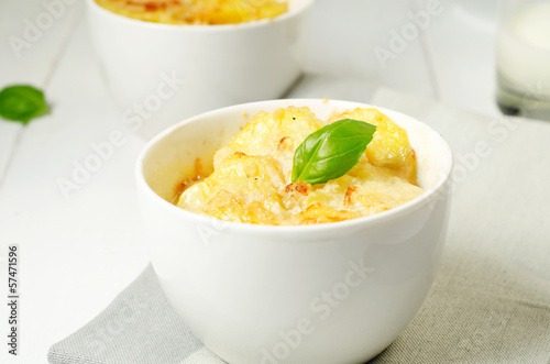 Photo: Potato gratin in the white bowls Potato gratin in the white bowls