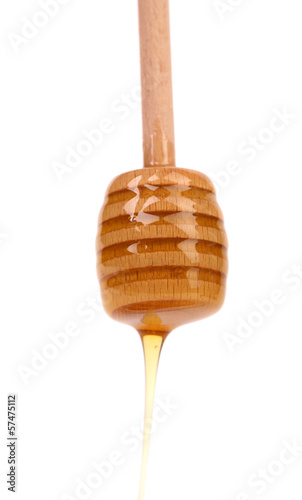 Photo: Honey on wooden dipper. Honey on wooden dipper.