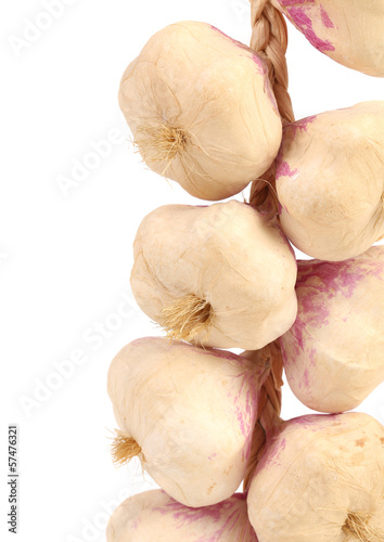 Photo: Close up of garlics plait. Close up of garlics plait.