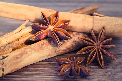 Photo: Star anise and cinnamon on a wooden background Star anise and cinnamon on a wooden background