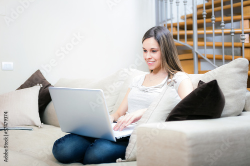 Photo: Woman using a laptop Woman using a laptop