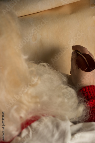 Photo: Close-up of Christmas letter in Santa Claus hands Close-up of Christmas letter in Santa Claus hands