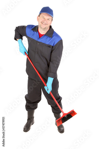 Photo: Man with cleaning broom. Man with cleaning broom.