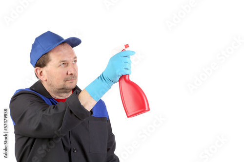 Photo: Man holds spray bottle. Man holds spray bottle.