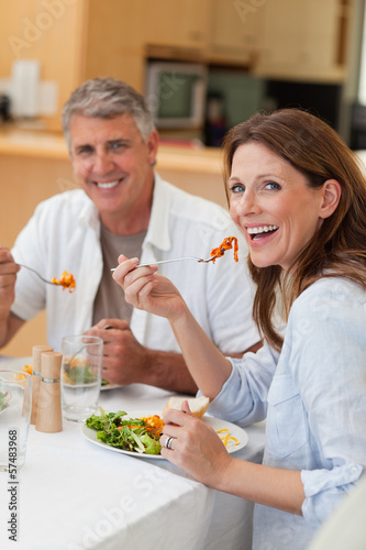Photo: Happy couple eating dinner together Happy couple eating dinner together