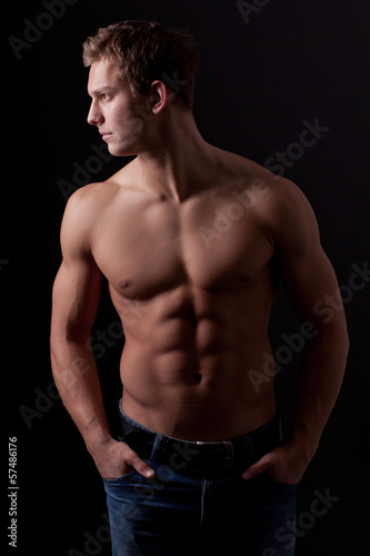 Photo: Muscle sexy naked young man posing in jeans Muscle sexy naked young man posing in jeans