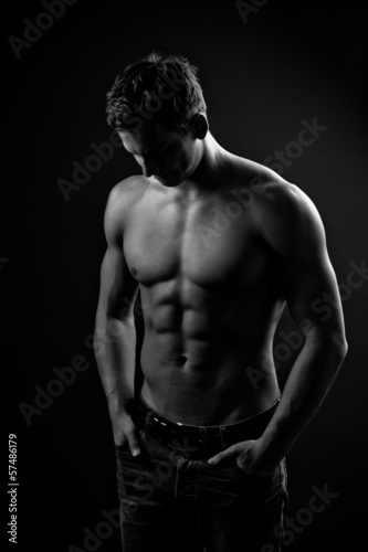 Photo: Muscle sexy naked young man posing in jeans Muscle sexy naked young man posing in jeans