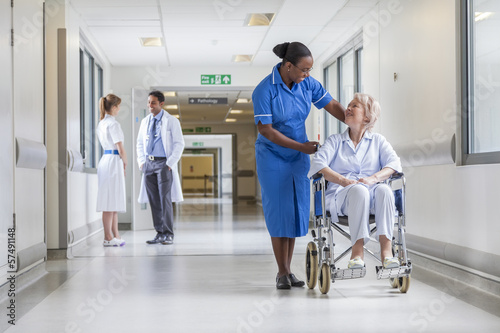 Photo: Senior Female Patient in Wheelchair & Nurse in Hospital Senior Female Patient in Wheelchair & Nurse in Hospital