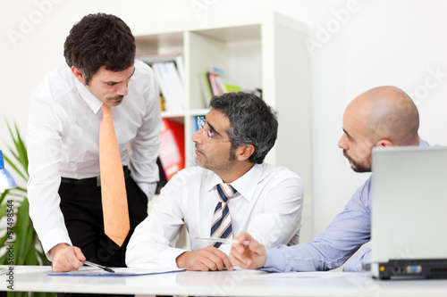 Photo: Business people talking on meeting at office Business people talking on meeting at office