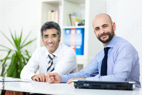 Photo: Couple of businessmen in the office Couple of businessmen in the office