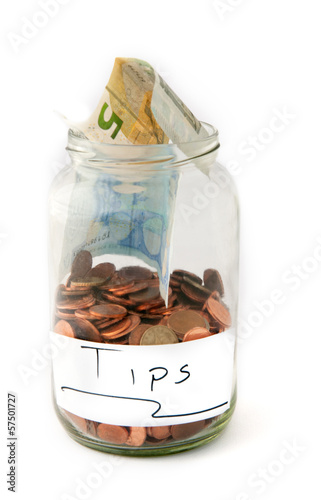 Photo: Jar with money for tips Jar with money for tips