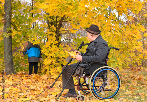 Photo: Disabled grandfather and grandchild outdoors Disabled grandfather and grandchild outdoors