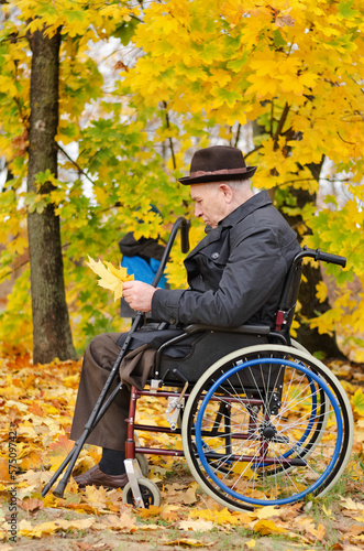 Photo: Disabled grandfather and grandchild outdoors Disabled grandfather and grandchild outdoors