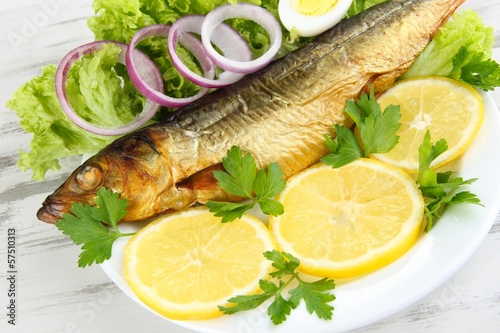 Photo: Smoked fish on plate close up Smoked fish on plate close up