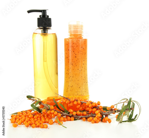 Photo: Branch of sea buckthorn with scrub and gel isolated on white Branch of sea buckthorn with scrub and gel isolated on white