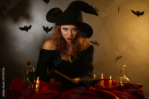 Photo: Halloween witch on dark background Halloween witch on dark background