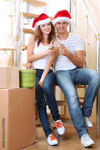 Photo: Young couple celebrating New Years in new home Young couple celebrating New Years in new home