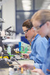 Photo: Technician using measurement probe on assembly line in steel bearing manufacturing plant Technician using measurement probe on assembly line in steel bearing manufacturing plant