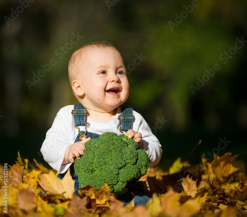 Photo: Healthy living - baby with brocoli Healthy living - baby with brocoli