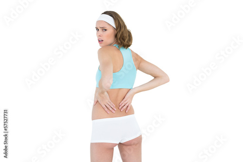 Photo: Attractive woman wearing sportswear looking at camera Attractive woman wearing sportswear looking at camera