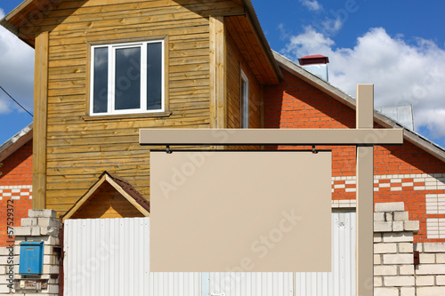 Photo: Billboard on background of the house Billboard on background of the house