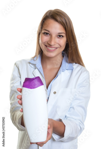 Photo: Female seller shows lotion Female seller shows lotion