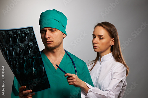 Photo: Medical doctors team with MRI spinal scan Medical doctors team with MRI spinal scan