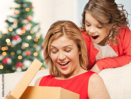 Photo: happy mother and child girl with gift box happy mother and child girl with gift box