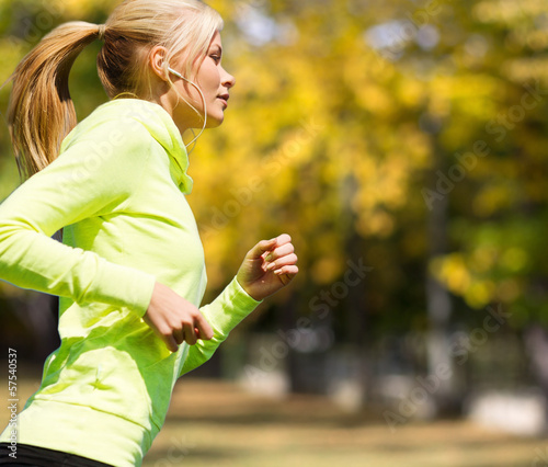 Photo: woman doing running outdoors woman doing running outdoors