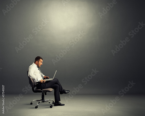 Photo: shocked businessman looking at laptop shocked businessman looking at laptop