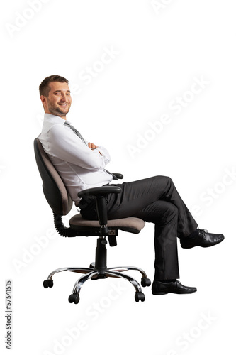 Photo: successful man sitting on the office chair successful man sitting on the office chair