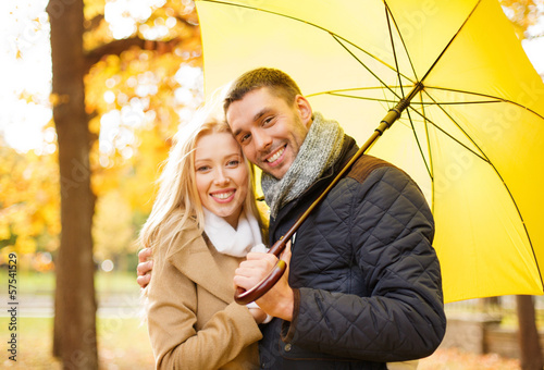 Photo: romantic couple in the autumn park romantic couple in the autumn park