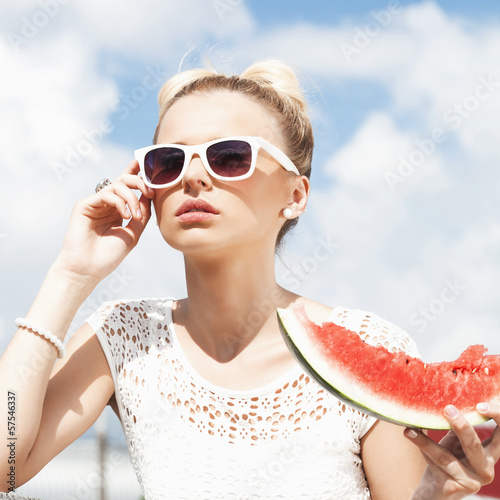 Photo: Woman takes watermelon. Concept of healthy and dieting food Woman takes watermelon. Concept of healthy and dieting food