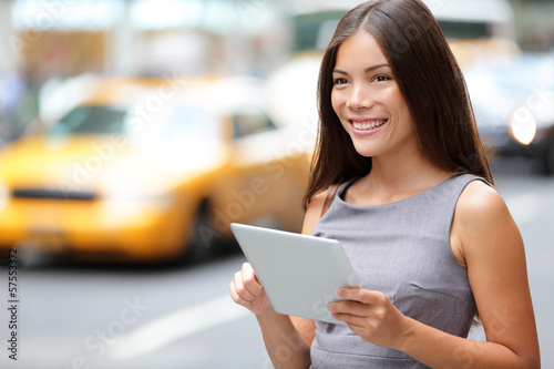 Photo: Tablet computer business woman in New York City Tablet computer business woman in New York City