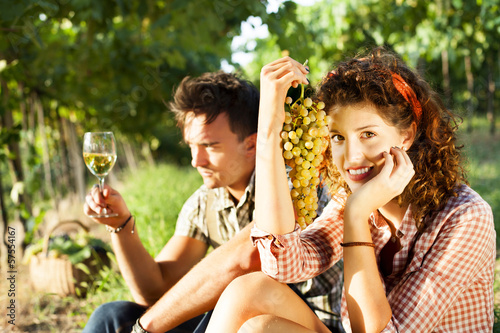Photo: farming couple relaxing after the grape harvest farming couple relaxing after the grape harvest