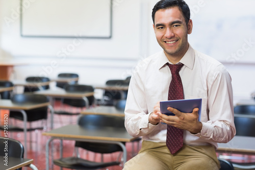 Photo: Teacher with tablet PC in the class room Teacher with tablet PC in the class room
