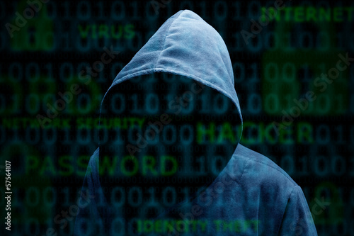 Photo: Hooded silhouette of a hacker Hooded silhouette of a hacker