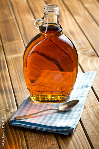 Photo: maple syrup in glass bottle maple syrup in glass bottle