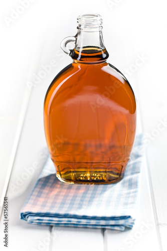 Photo: maple syrup in glass bottle maple syrup in glass bottle