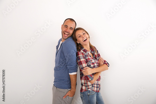 Photo: Young couple laughing outloud, isolated Young couple laughing outloud, isolated