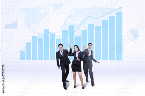 Photo: Happy business team with growth graph Happy business team with growth graph