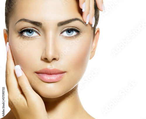 Photo: Beauty Portrait. Beautiful Spa Woman Touching her Face Beauty Portrait. Beautiful Spa Woman Touching her Face