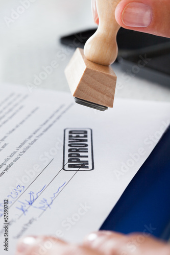 Photo: Business Man Hand With Rubber Stamp Business Man Hand With Rubber Stamp